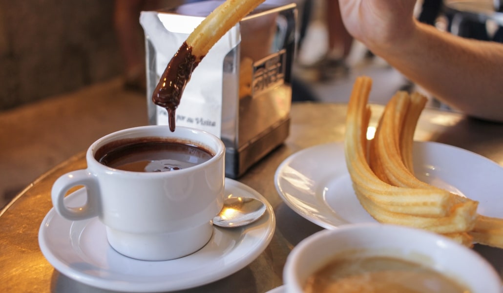 Churros with chocolate for breakfast in Seville